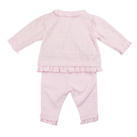 Introducing our new season arrival, the girls pink short tunic top & legging set from childrenswear boutique brand, Mintini Baby. This girls two piece outfit is part of our spring summer collection, and it offers a stylish and comfortable option for your little girl. The pink tunic top features a round neck collar and delicate frill details, while the leggings have an elasticated waistband for a perfect fit. Available in sizes 3 months to 24 months.