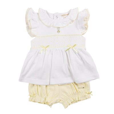 This two piece outfit, branded by Mintini Baby, offers a unique combination of comfort and style. The lemon top features a yellow smocked design and a charming bow detail. Paired with the matching lemon bloomers, this set is perfect for sizes 3 months up to 24 months. Transform any day into a sunny delight with this adorable set.