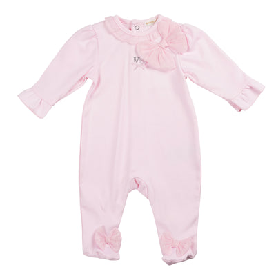 Introducing our new season collection from Mintini Baby, a boutique brand for baby girls. This pastel pink all in one sleeper features a charming ruffle collar, and a delicate bow on the side and also on the feet. Push button fastening on the reverse. Available in sizes 1 month, 3 months, and 6 months.