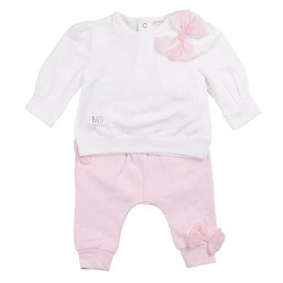 Introducing the new girls white &amp; pink two piece jogger set from the famous baby &amp; childrenswear boutique brand, Mintini Baby. This spring/summer arrival is perfect for your little girl. The outfit features a white long sleeve top with a delicate pink bow detail and pink joggers with bow detail on the leg. Available in sizes 3-24 months.