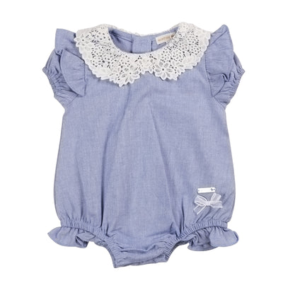 Introduce your little girl to fashion with this girls blue &amp; white short sleeve romper from baby boutique brand, Mintini Baby. This new arrival from their spring summer collection features a stylish blue design, complete with a delicate white crochet neck frill. With button fastening on the reverse and sizes up to 6 months available, your little one will be both comfortable and trendy.