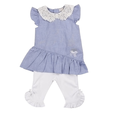 Elevate your little girl's style with our girls blue &amp; white two piece tunic and leggings set. This cute girls outfit is made by childrenswear clothing brand Mintini Baby, this set includes a blue short sleeve tunic with delicate crochet frill detail around the neck, paired with white leggings adorned with a frill on the ankle. Available in sizes from 3 months and go up to 5 years old, this set also offers the perfect opportunity for matching outfits with big sisters and little sisters.