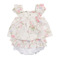 The girls ivory floral two piece top & jam pant set is a stylish and versatile addition to any little girl's wardrobe. Made with a beautiful ivory floral top and white jam pants, this set is perfect for the spring and summer seasons. Available in sizes 3 months to 24 months, and branded by Mintini Baby, your little one will feel comfortable and stylish in this two piece set.