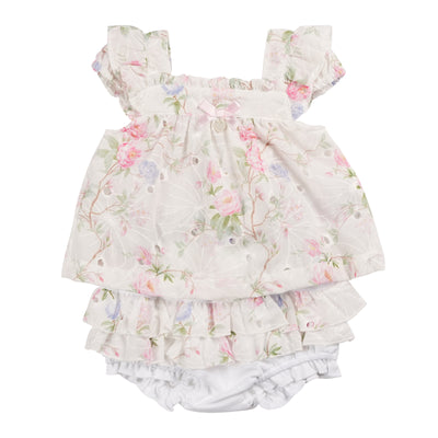 The girls ivory floral two piece top &amp; jam pant set is a stylish and versatile addition to any little girl's wardrobe. Made with a beautiful ivory floral top and white jam pants, this set is perfect for the spring and summer seasons. Available in sizes 3 months to 24 months, and branded by Mintini Baby, your little one will feel comfortable and stylish in this two piece set.