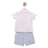 Technical flat lay back view of the Mintini boys white and beige top and shorts set showing the rear button fastenings and elasticated waistband.
