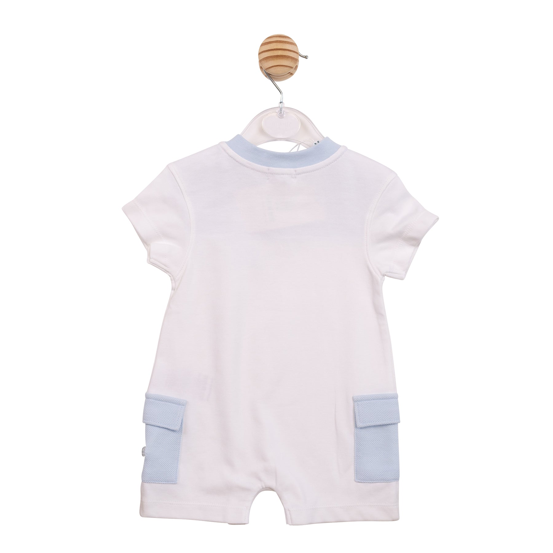Designer infant white romper with blue cargo pockets and shoulder poppers.