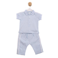 Technical flat lay front view of the Mintini boys blue and white two-piece polo and trouser set.