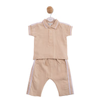 Technical flat lay front view of the Mintini boys beige and white two-piece polo and trouser set.