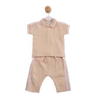Technical flat lay front view of the Mintini boys beige and white two-piece polo and trouser set.