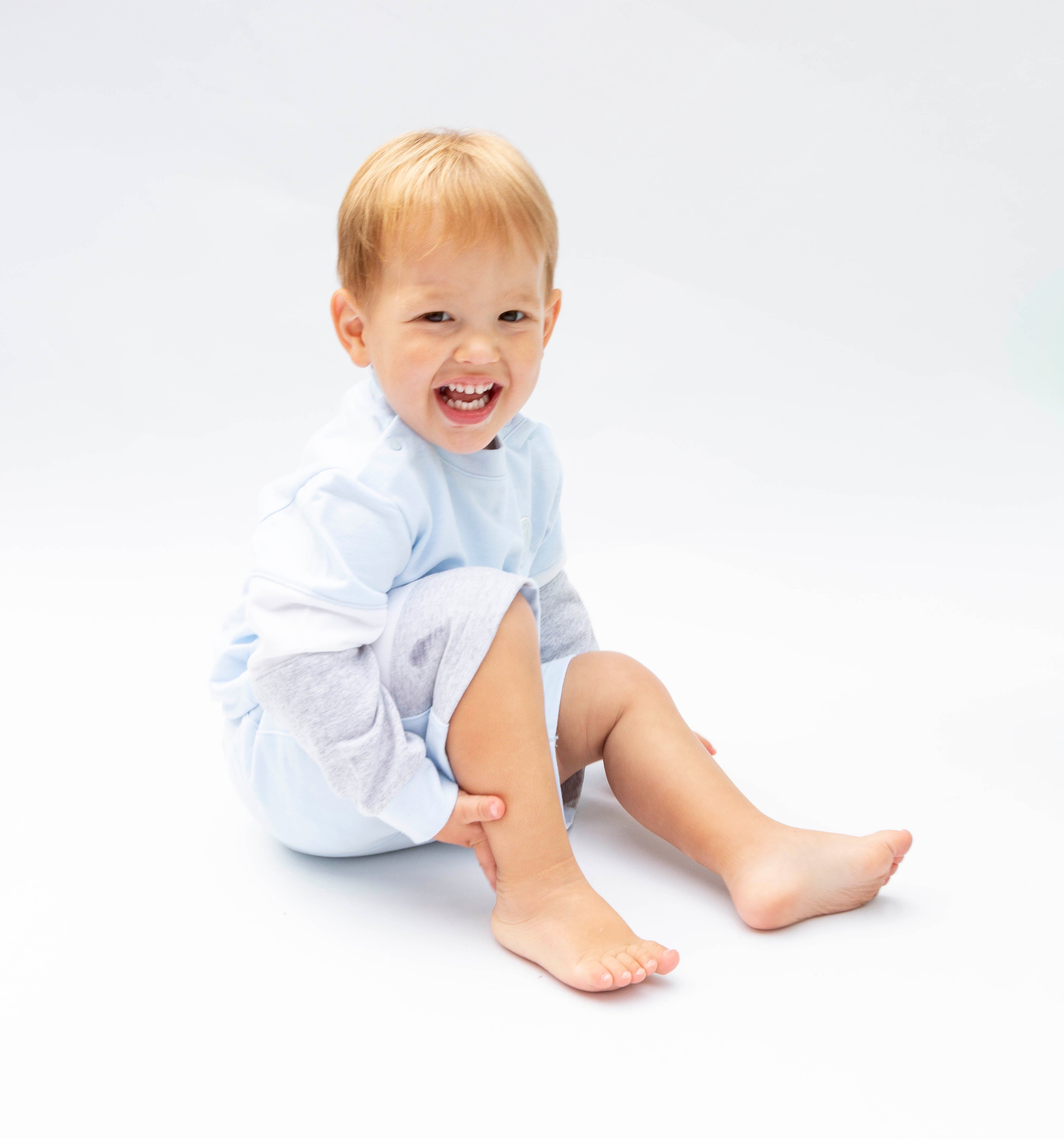 <p>Keep your little boy stylish and comfortable this spring and summer with our Mintini Baby branded boys sweater and shorts set. Available in sizes 3 month up to 24 months, this set features a round neck sweater and elasticated waistband shorts in a classic pastel blue, white, and grey colour scheme. Perfect for any occasion, let him enjoy the warm seasons in style.</p>