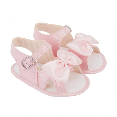 These adorable baby girls soft sole summer sandals are perfect for your little one's warm-weather adventures. The buckle fastening ensures a secure fit, while the soft sole and padded insole provide comfort for growing feet. The anti-slip sole gives added peace of mind for parents. Complete with a pretty satin bow detail, these sandals are both cute and functional. Not suitable for walking babies.