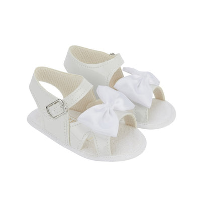 These charming white baby girl sandals are the ideal choice for your little one's summer escapades. The buckle fastening guarantees a snug fit, while the soft sole and cushioned insole offer comfort for developing feet. With a non-slip sole for added reassurance, these sandals also feature a lovely satin bow detail – making them both adorable and practical. Not recommended for walking infants.