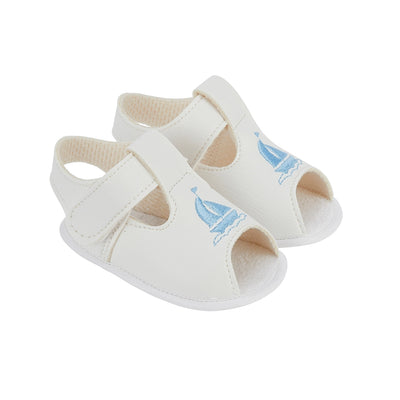 Introducing the ideal summer sandals for your infant son - our white soft sole sandals. Adorned with an adorable boat detail, these sandals offer a velcro fastening for quick and effortless wear, a cushioned inner sole for maximum comfort, and a slip-resistant sole for additional safety. Please note: Not recommended for babies who are walking.