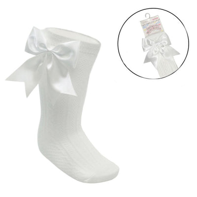 Cream ribbed baby knee-length socks with large satin bow for girls aged 0–24 months
