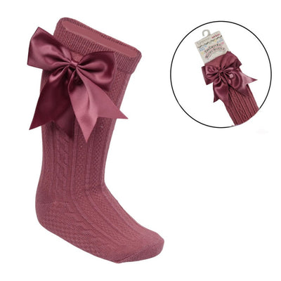 Dusty pink ribbed baby knee-length socks with large satin bow for girls aged 0–24 months