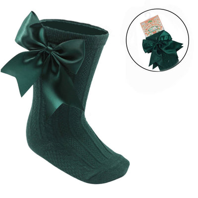 Green ribbed baby knee-length socks with large satin bow for girls aged 0–24 months