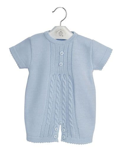 <p>Expertly designed by Dandelion, this beautiful acrylic knitted traditional blue romper for baby boys exudes elegance and charm. Featuring a lovely knitted pattern across the front, this romper is expertly manufactured in Portugal and is available in two charming colourways: blue and white. Available in sizes for newborn, 0-3 month, 3-6 month &amp; 6-12 month.