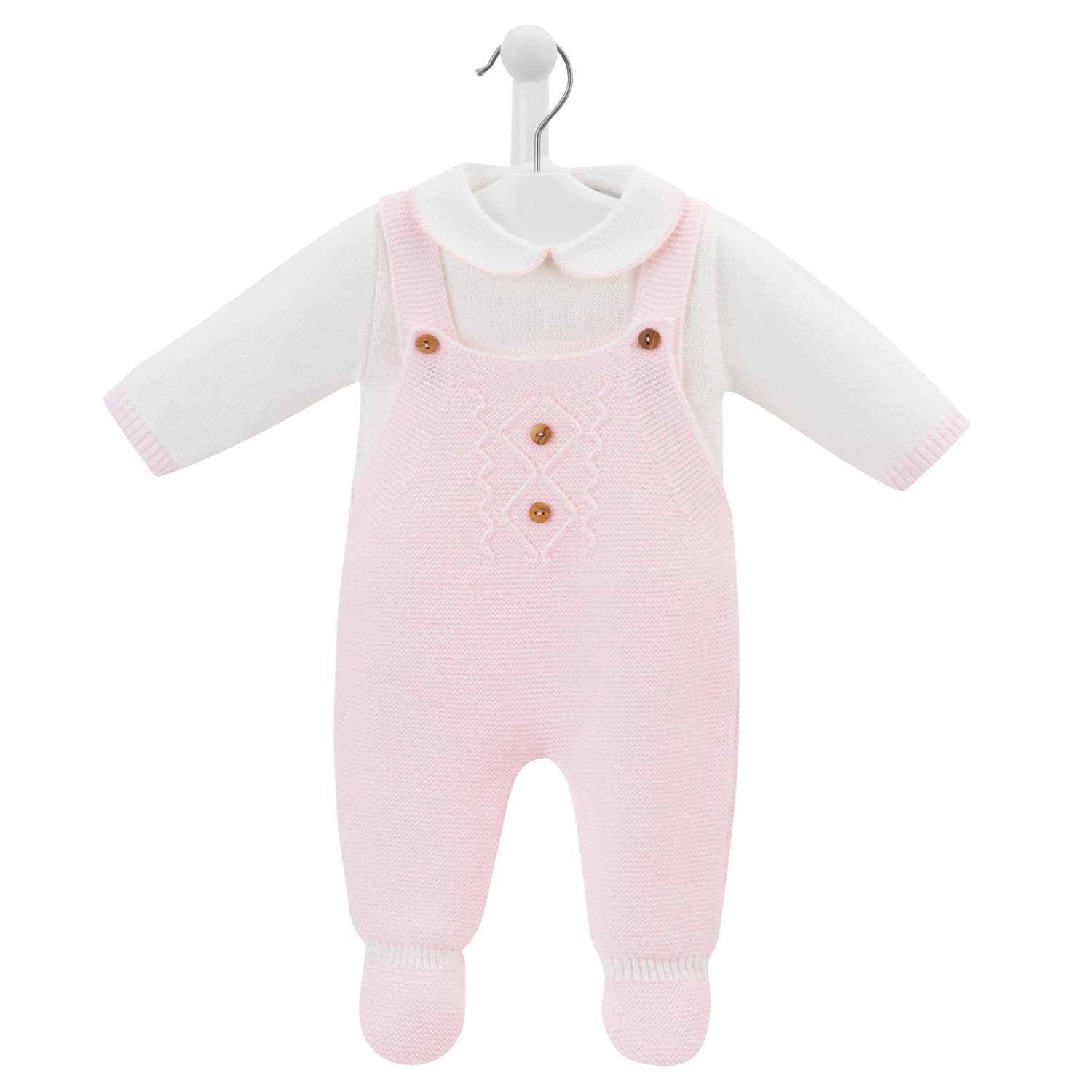 This stylish baby girls pink knitted dungaree & top set is expertly crafted from Portugal for Dandelion. Featuring a pique Peter Pan collar on the jumper and two wooden buttons on the straps for easy dressing, this set adds a fashionable element to any baby girl's wardrobe. Available in sizes newborn to 9 months.