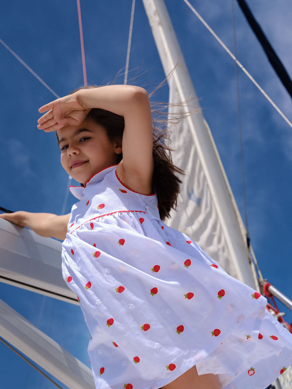 Designer girls summer dress by Deolinda featuring all-over strawberry motif