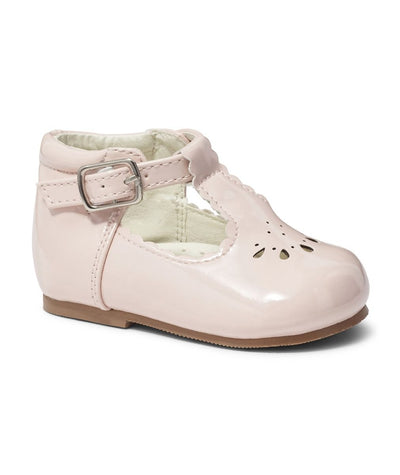 Sevva offers these exquisite infants' T-bar shoes in a charming pink patent finish, featuring a chic cut-out pattern. With a firm sole for support and a secure buckle fastening, these shoes are both comfortable and stylish for growing feet. Available in sizes 2 to 6.
