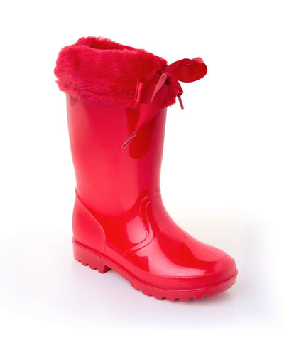 Experience both fashion and function this season with our girls red soft fur cuff ribbon tie wellies from Sevva. Crafted from a sturdy rubber material, these wellies come in white, red, and black, and are available in sizes ranging from infant 7 to junior 2.5. Perfect for completing any autumn or winter ensemble without compromising on style or protection from the rain.