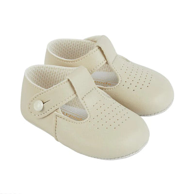 These biscuit pre-walker baby shoes, from our Baypods collection, are beautifully made in soft faux leather and have a dainty holed pattern on the toes. In a t-bar style, they are easy to put on and secure with a button fastening strap. They have a lightly cushioned insole and their flexible soles are just right for developing feet.  Faux leather Lightly cushioned insole  Flexible soles Button fastening strap Shoes suitable for boys & girls