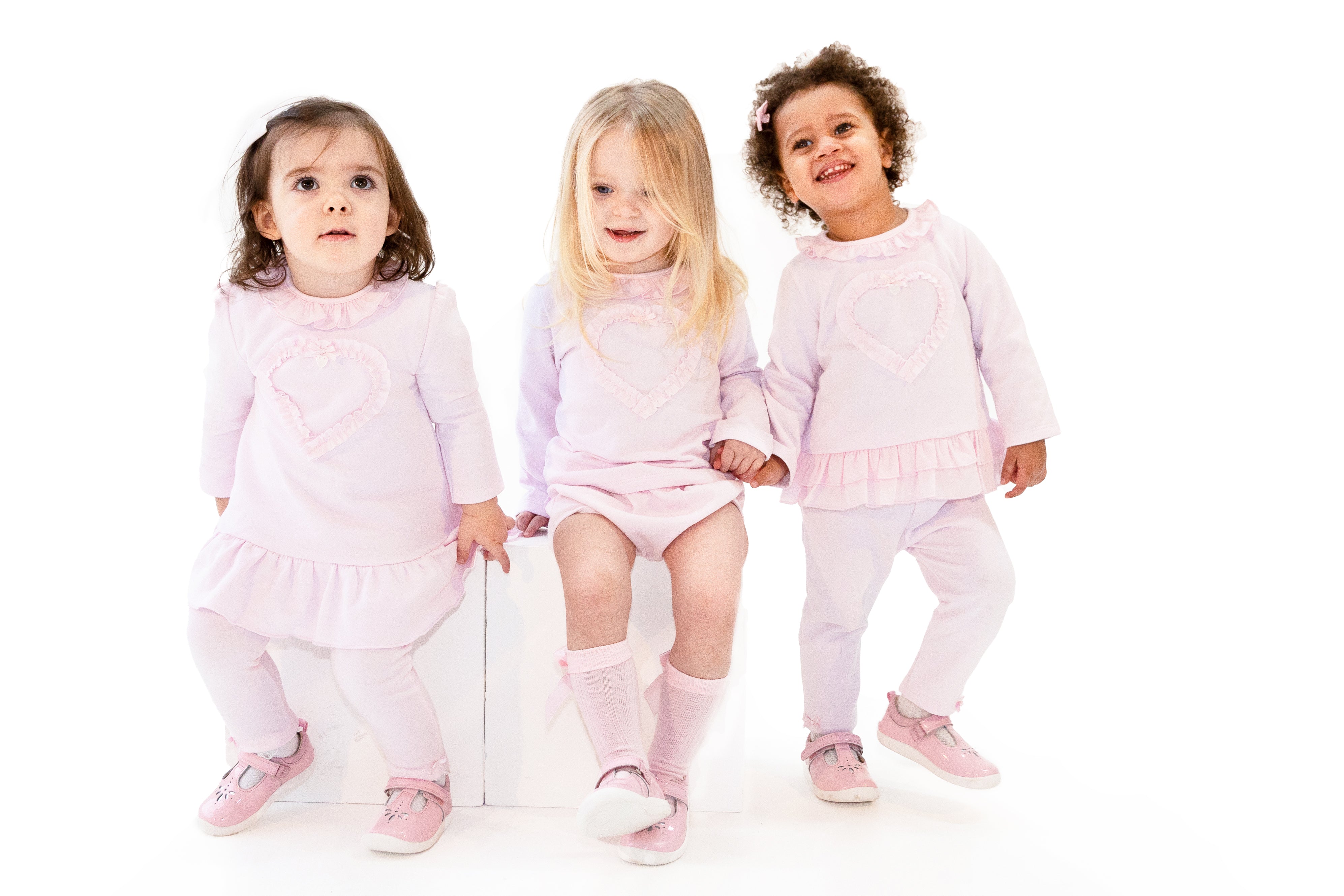 Kidz Emporium luxury kidswear warehouse liquidation sale selection - illustrative lifestyle example of designer baby girl smocked dress