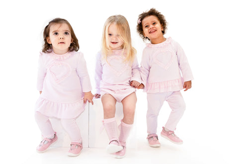 Kidz Emporium luxury kidswear warehouse liquidation sale selection - illustrative lifestyle example of designer baby girl smocked dress