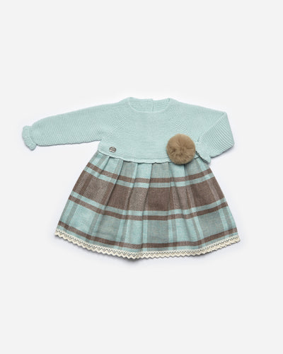 Beautiful girls knitted dress finished in a green and brown tartan and has a large pom to the side on the front. This dress is by Juliana and is available in sizes 3m up to 4yr.