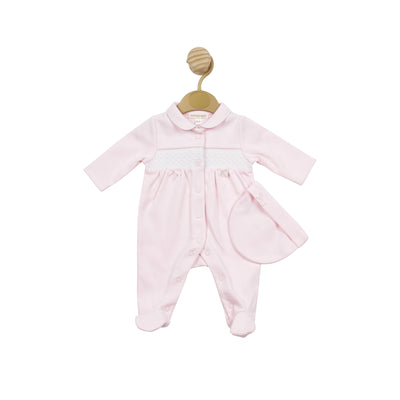 This all in one sleep suit and matching hat, designed for premature baby girls, is a product by the baby boutique brand Mintini Baby. The set features a beautiful pink colour and a white smocked detail that runs across the center. It is available in sizes 3/5lb, 5/8lb, and newborn.