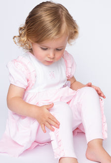 Kidz Emporium luxury children's clothing brand end of line sale - illustrative lifestyle example of boutique style baby girl sleepsuit, bloomers and leggings sets