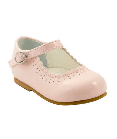 This elegant girls traditional mary jane shoe by Sevva boasts a sleek pink pastel patent finish. Ideal for formal events like christenings and parties, this shoe features a convenient buckle fastening on the side. Choose from White, Pink, or Burgundy in sizes 2 up to 8.