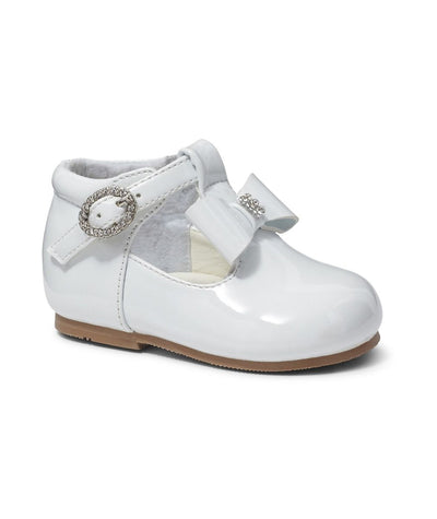 Girls Sevva branded hard sole shoes. These shoes are a t-bar design with a bow in the middle and has small diamanté detail in the middle of them. They have a buckle fastening with diamanté detail around it. Perfect shoes for parties & christenings. These are available in infant sizes 2 up to 6. These are available in four different colours - White, Pink, Navy & Red.
