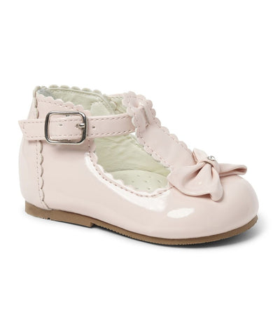 Girls Sevva branded pink hard sole shoes. These shoes are a classic t-bar design with a small bow to the front, which is finished with a diamanté detail in the middle. They come up slightly higher on the back to give your little one extra support around the ankle, and they have a buckle fastening to the side.These shoes are perfect for parties & christenings. These are available in infant sizes 2 up to 8.